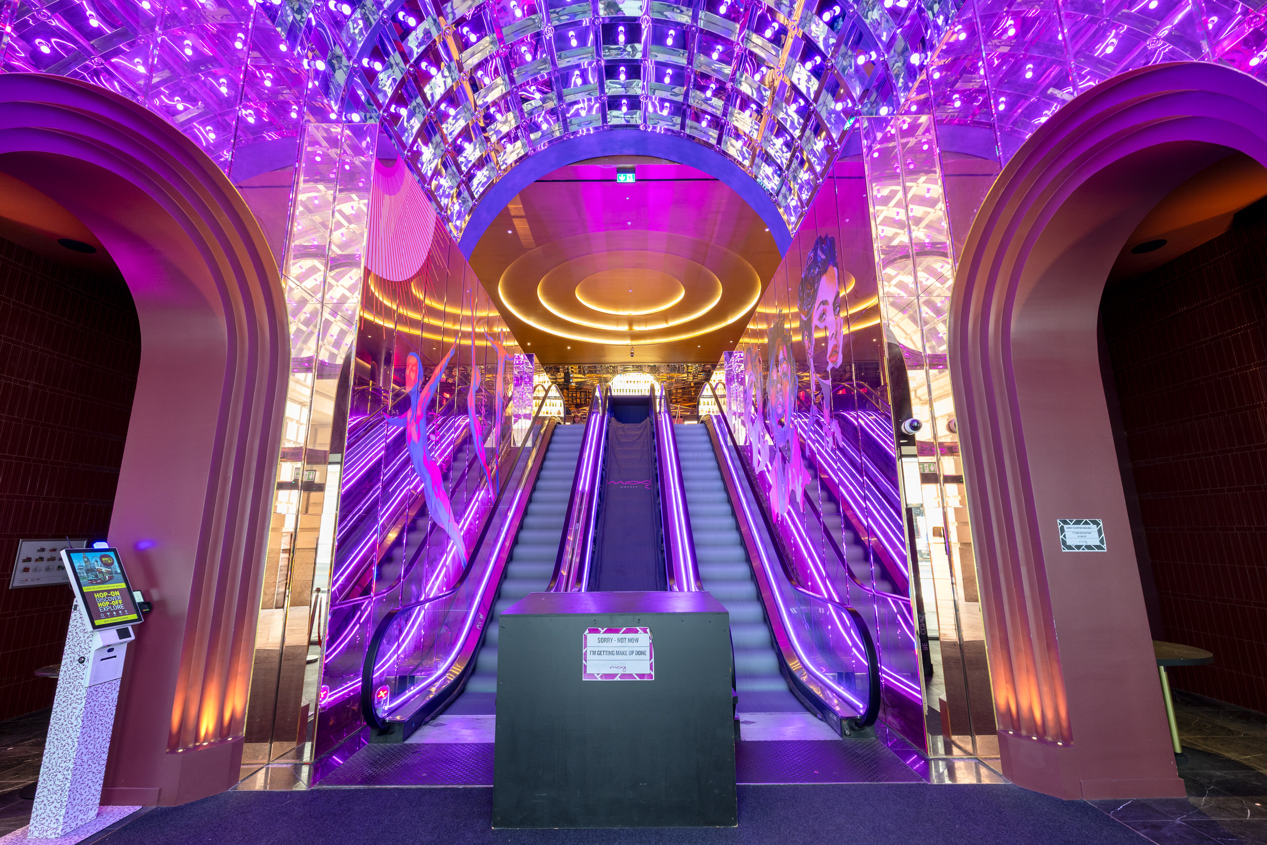 Moxy Piccadilly — the completed escalator hall and lit feature ceiling